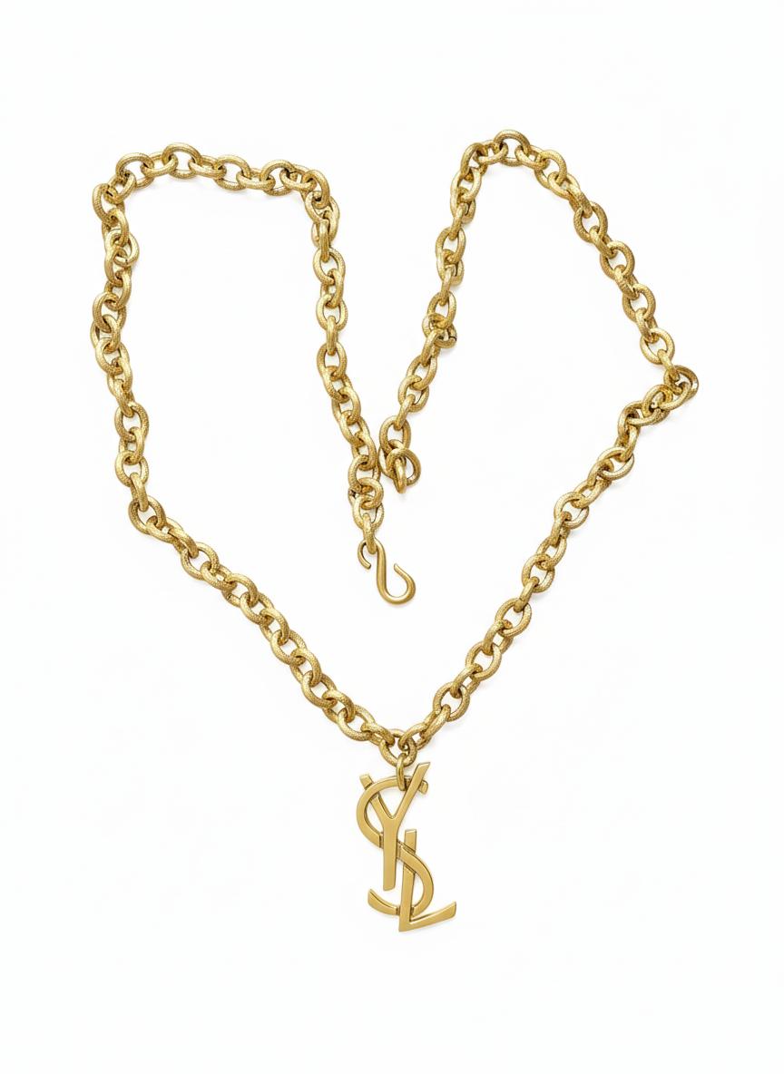 Authentic YSL oversized gold logo bag charm pendant repurposed into a long chain necklace displayed on white background 
