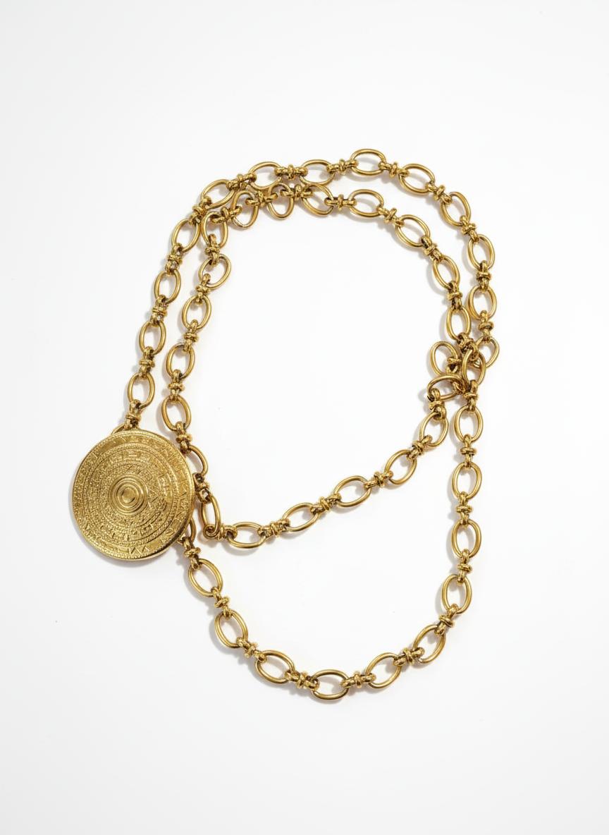 Yves Saint Laurent vintage 80s scarf holder Gold chain necklace on a white background
