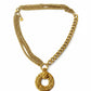 Yves Saint Laurent vintage pendant  paired with stainless steel chain necklace on white background 