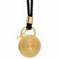 Gold yves saint laurent pendant necklace with black cord on a white background