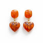 orange resin heart shaped earrings from yves saint laurent 