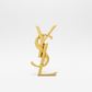 YSl gold pin brooch on white bacj