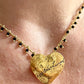Yves Saint Laurent golden heart pendant