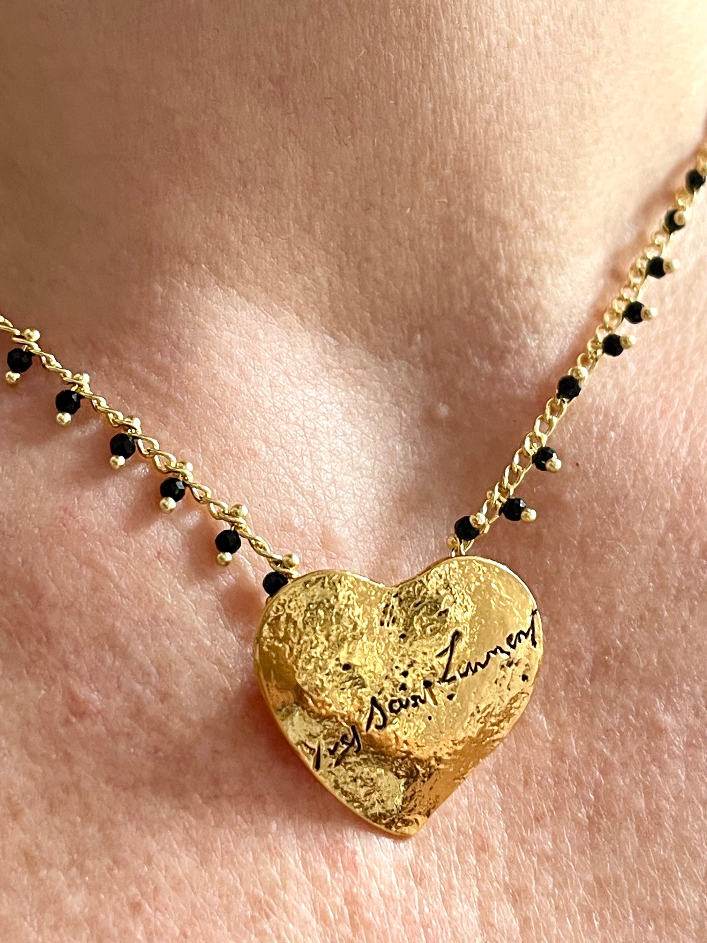 Yves Saint Laurent golden heart pendant