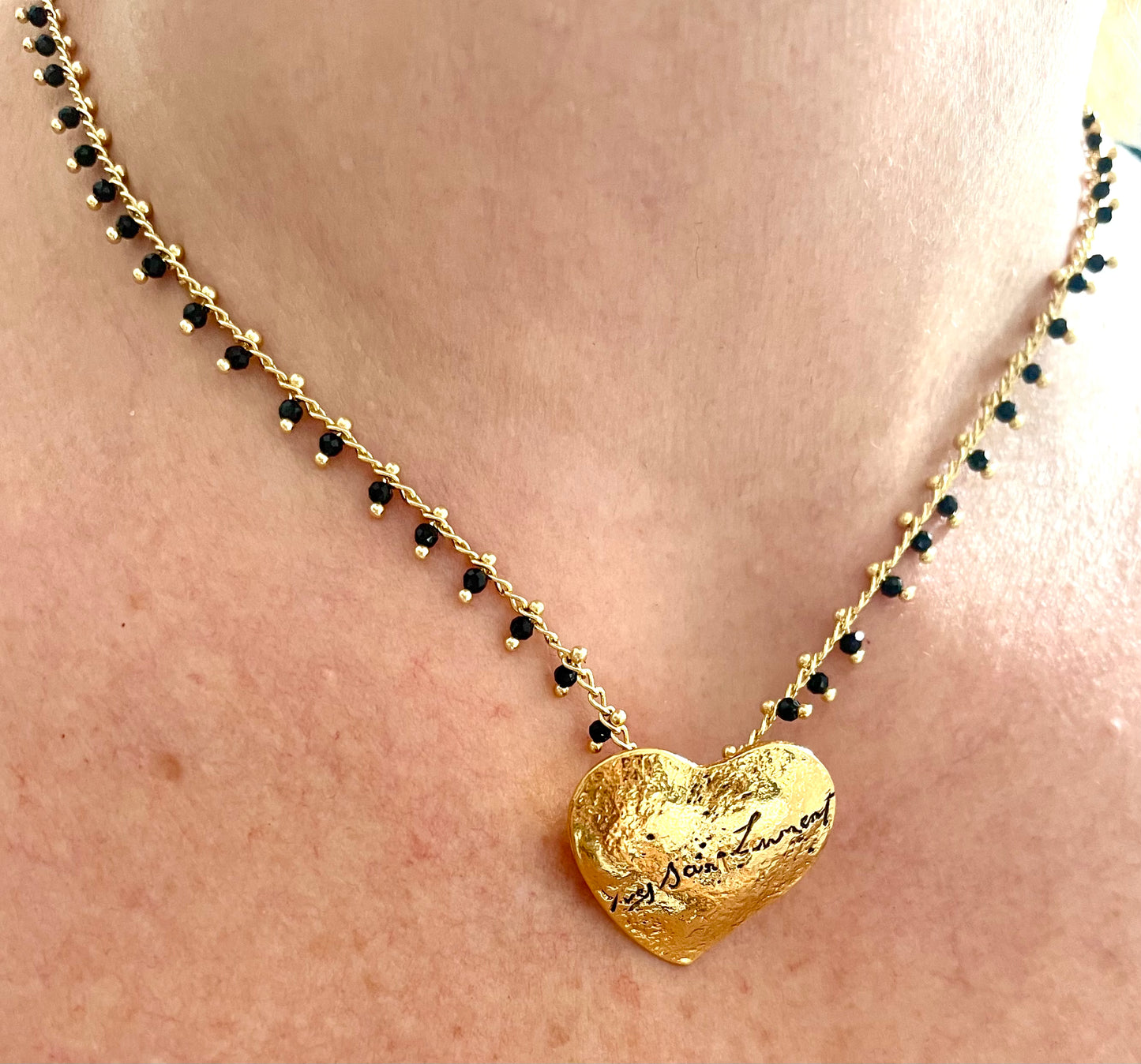 Yves Saint Laurent golden heart pendant